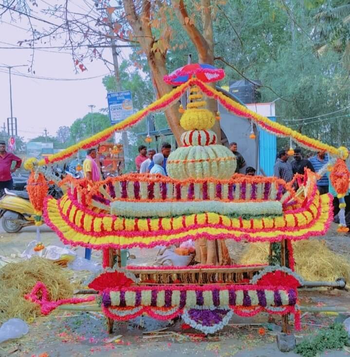 Traditional Hindu funeral bier decorated with flowers for cremation ceremony in Bangalore